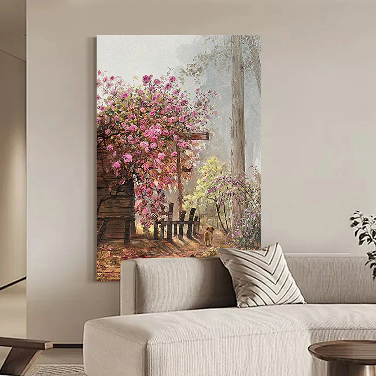 Blush Garden rose oil painting displayed unframed above a neutral sofa