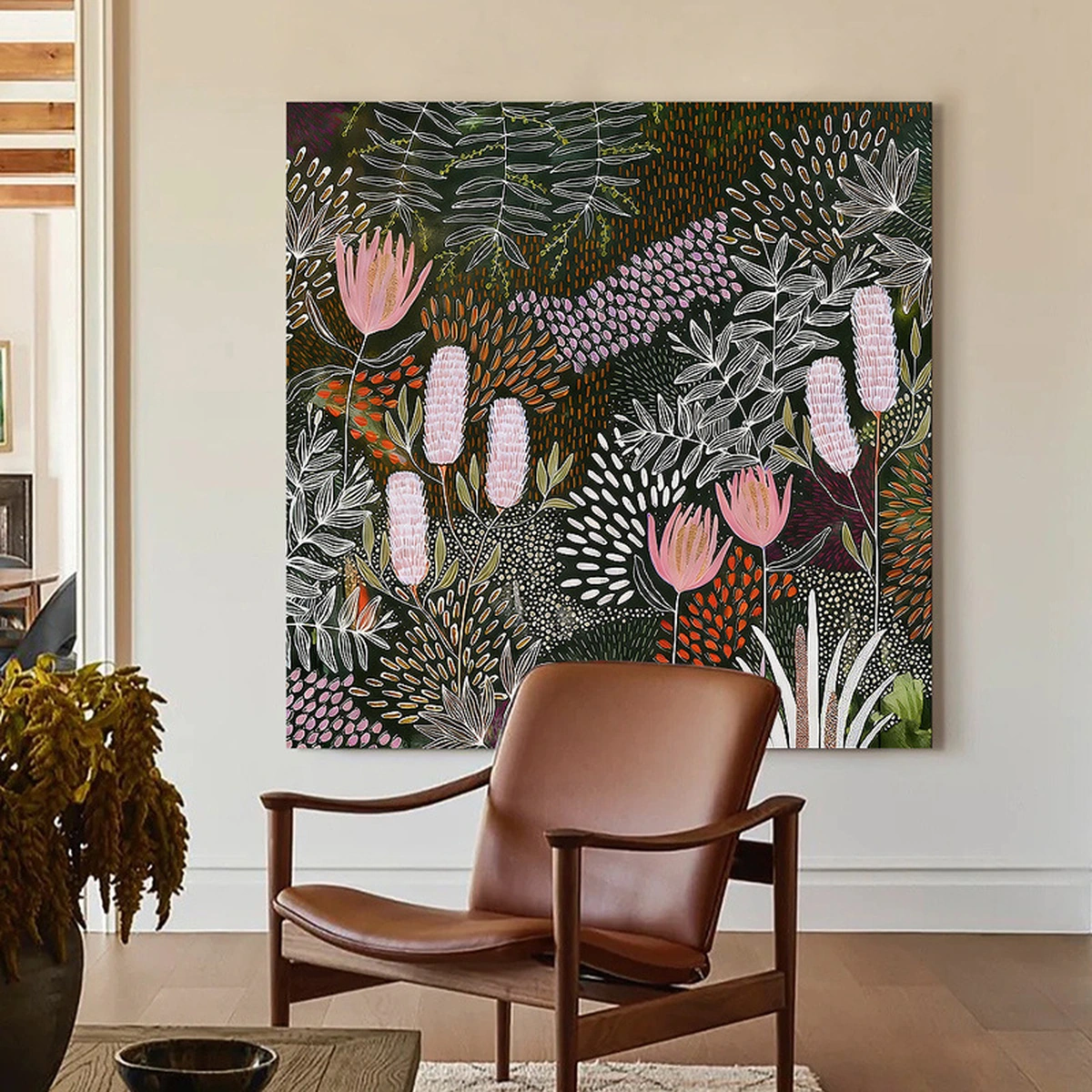 Jungle Veil square botanical painting displayed unframed above a leather chair