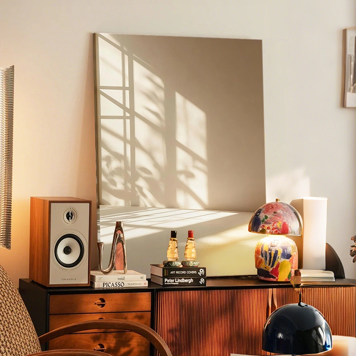 Light Echo warm neutral painting displayed unframed above a wood sideboard